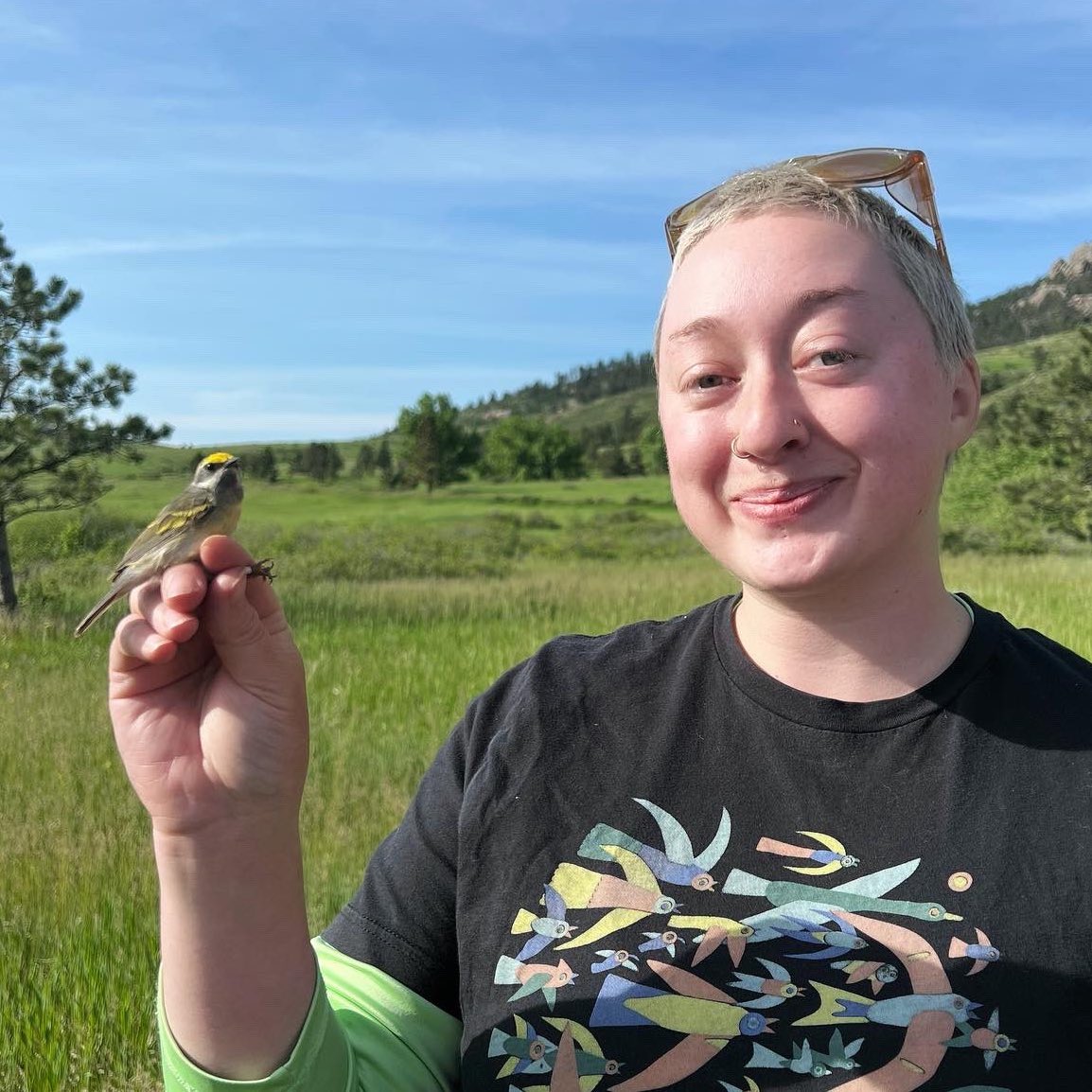 Carolyn Coyle with an Orange Crowned Warbler